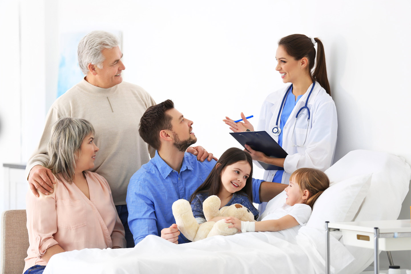 A family meeting with a friendly doctor at a bedside